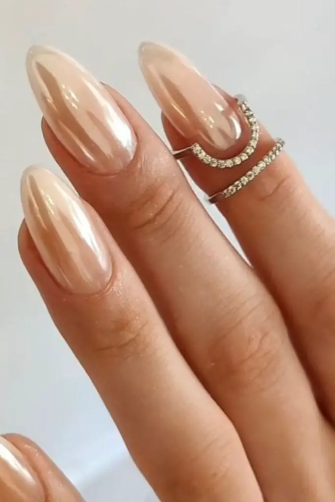 Long Almond Light Nude Pearlescent Chrome With Rhinestone — Simple Nude Chrome Nails