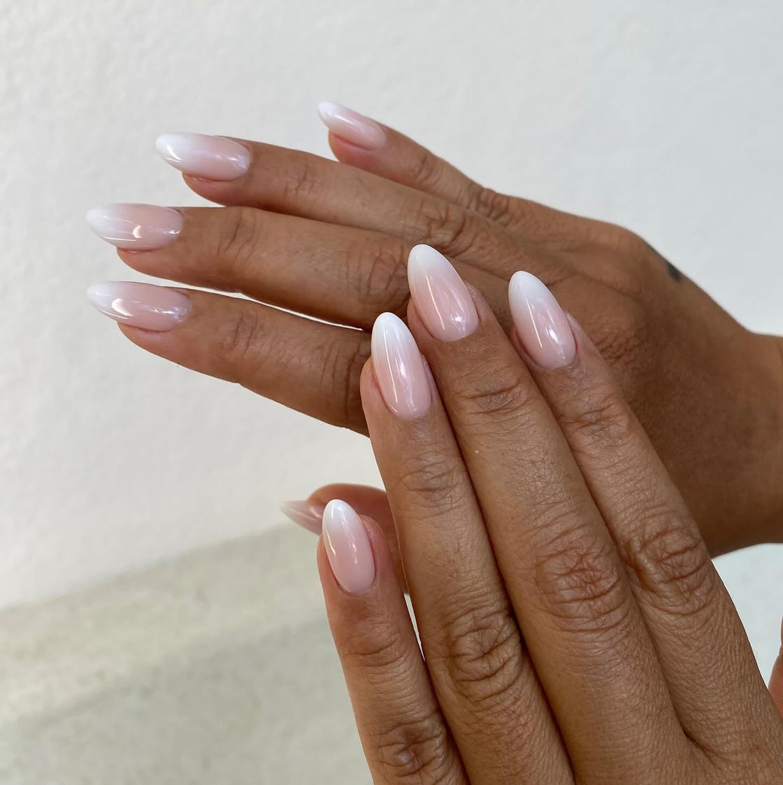 Nude to White Glossy Almond French Fade, Close-Up Take Nude to White Glossy Almond French Fade, Close-Up Take — Simple Ombre Nails