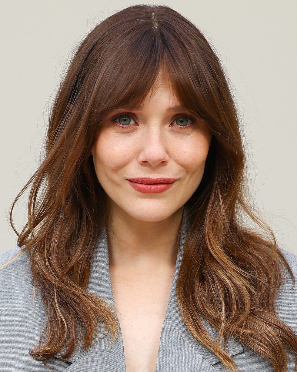 Mid-Back Length With Long Flowing Layers Mid-Back Length With Long Flowing Layers — Simple Oval Face Haircuts