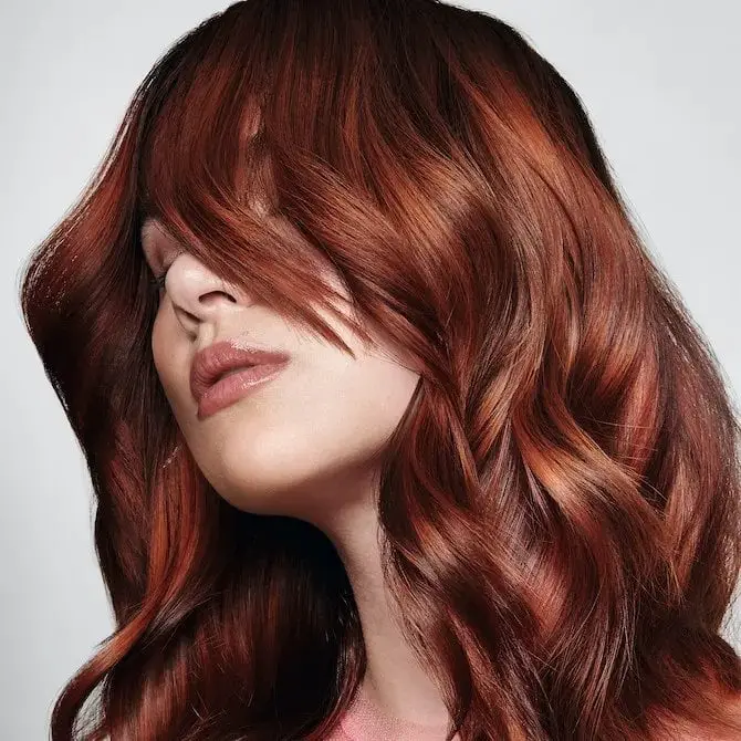 Deep Red Mid-Back Waves With Undertones and Curtain Bangs — Simple Red Hair Colors