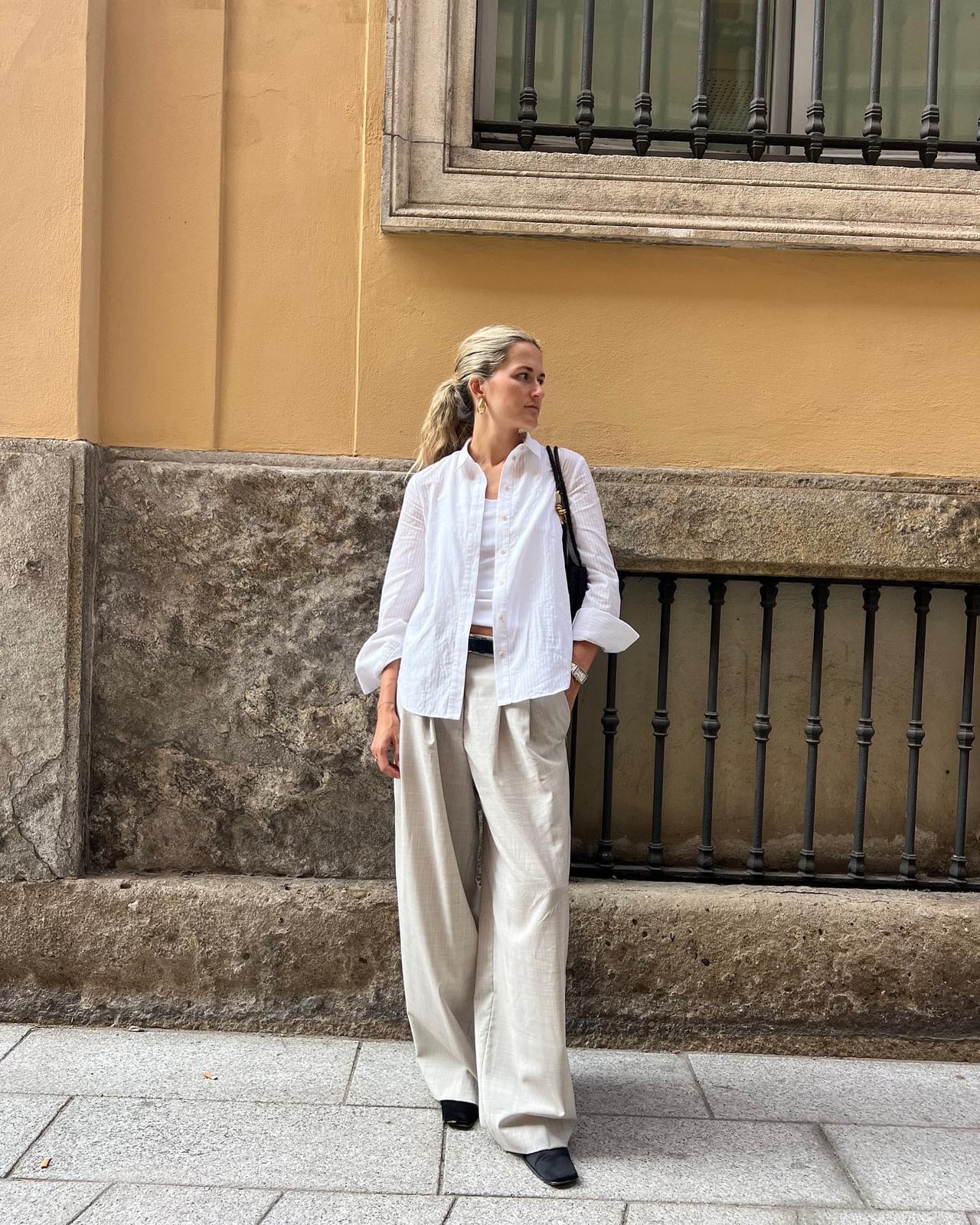 Oversized White Shirt with Wide-Leg Beige Trousers Oversized White Shirt with Wide-Leg Beige Trousers — Simple Road Trip Outfits