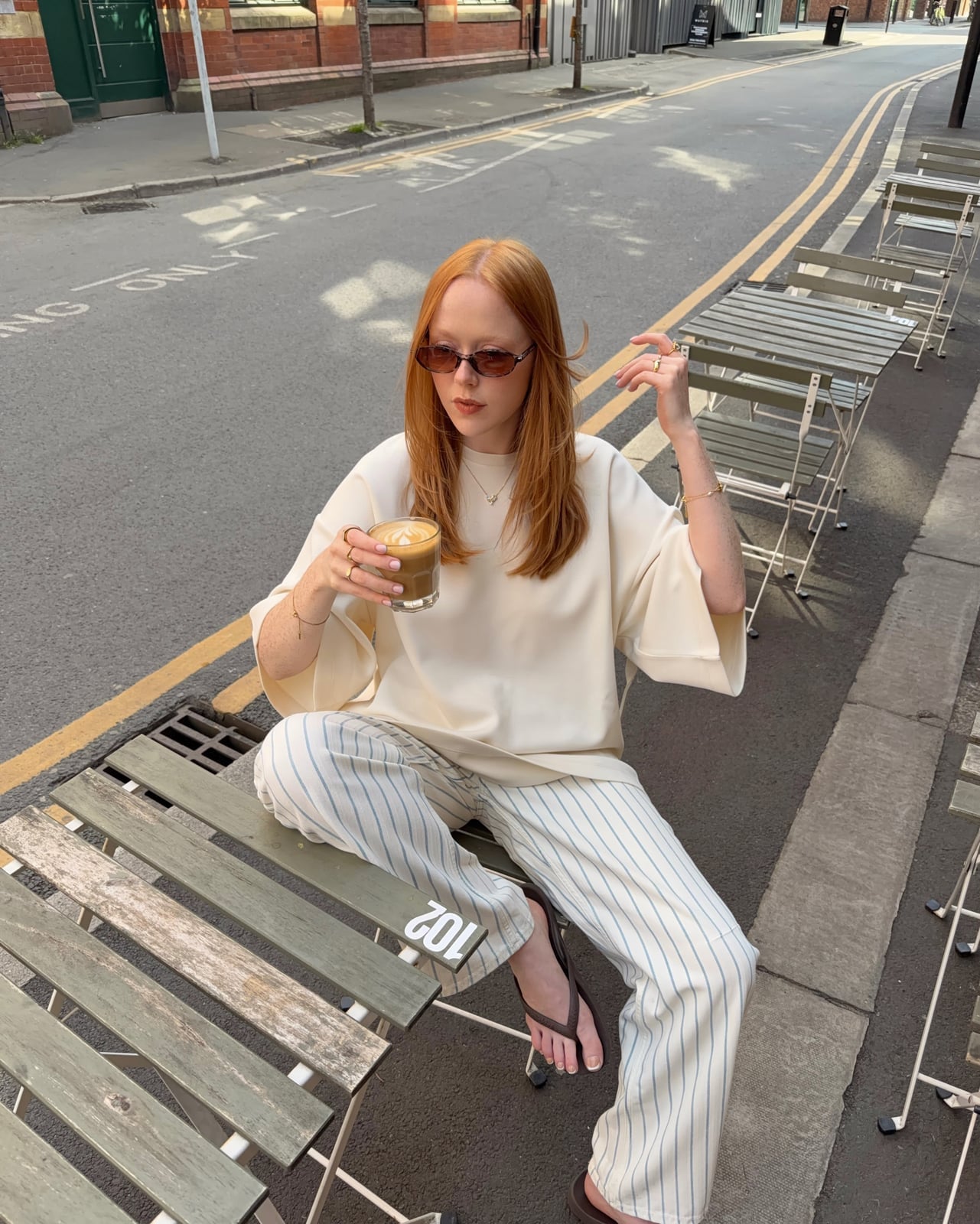 Striped Wide-Leg Trousers with an Oversized T-Shirt, Flip-Flops Striped Wide-Leg Trousers with an Oversized T-Shirt, Flip-Flops — Simple Road Trip Outfits