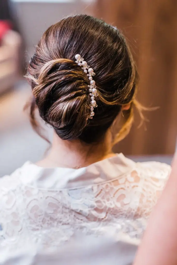 Low Bun Updo With Pearl Accessory Low Bun Updo With Pearl Accessory — Simple Strapless Dresses Hairstyles