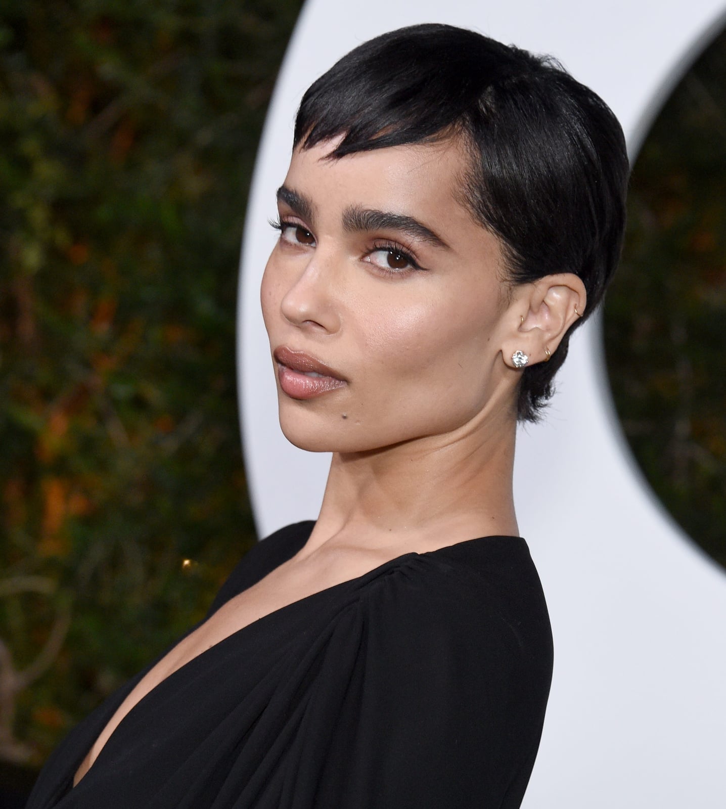 Sleek Layered Black Pixie With Swept Bangs Sleek Layered Black Pixie With Swept Bangs — Simple Textured Pixie