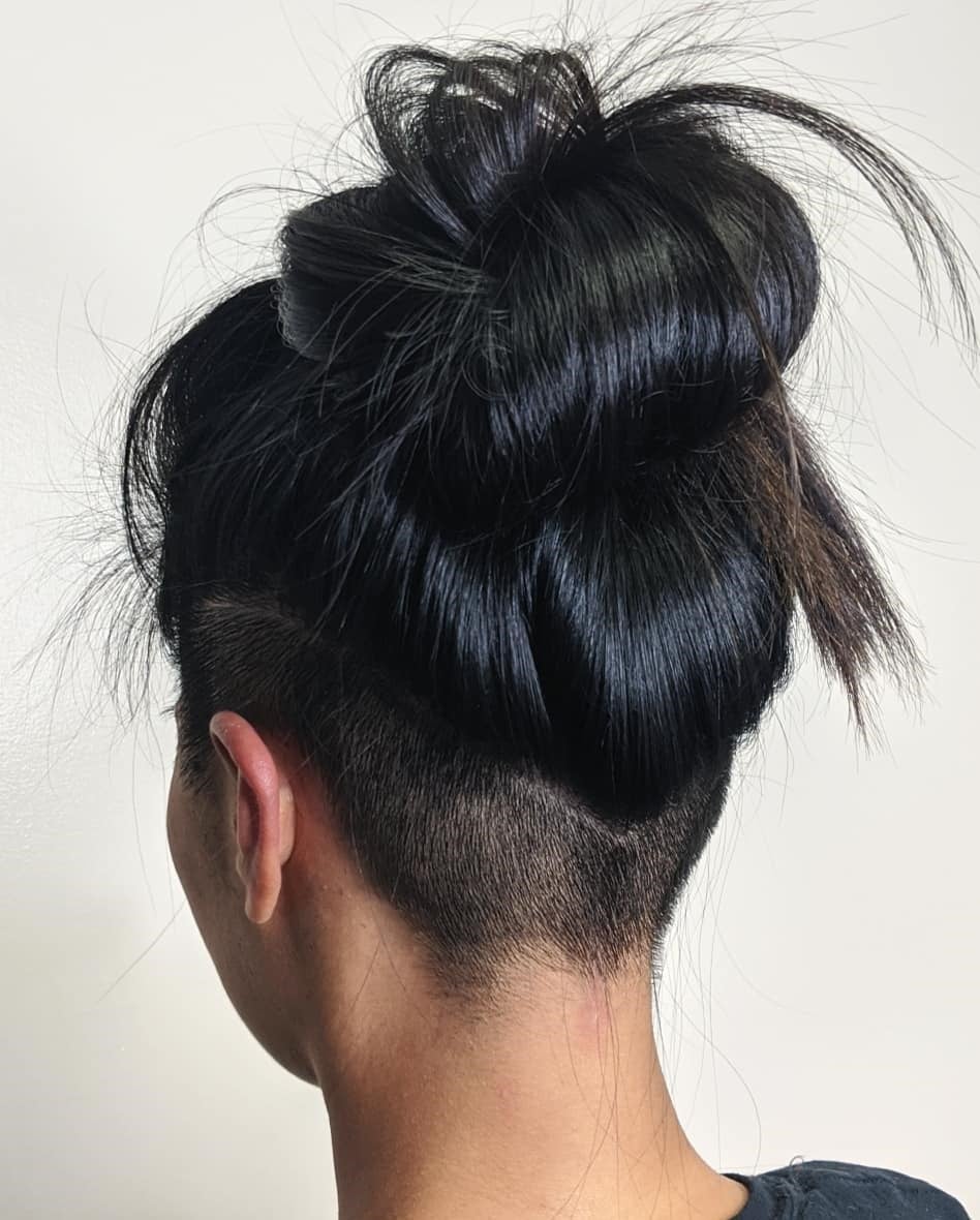 Black Hair High Messy Bun With Curved Undercut Black Hair High Messy Bun With Curved Undercut — Simple Undercut Hairstyles