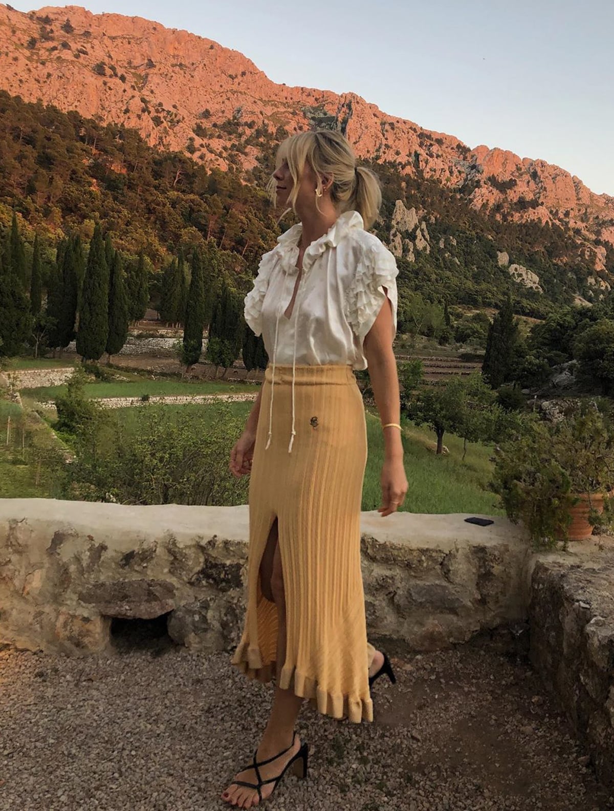 White Ruffled Blouse with Yellow Ribbed Knit Midi Skirt White Ruffled Blouse with Yellow Ribbed Knit Midi Skirt — Simple Wedding Guest Outfits