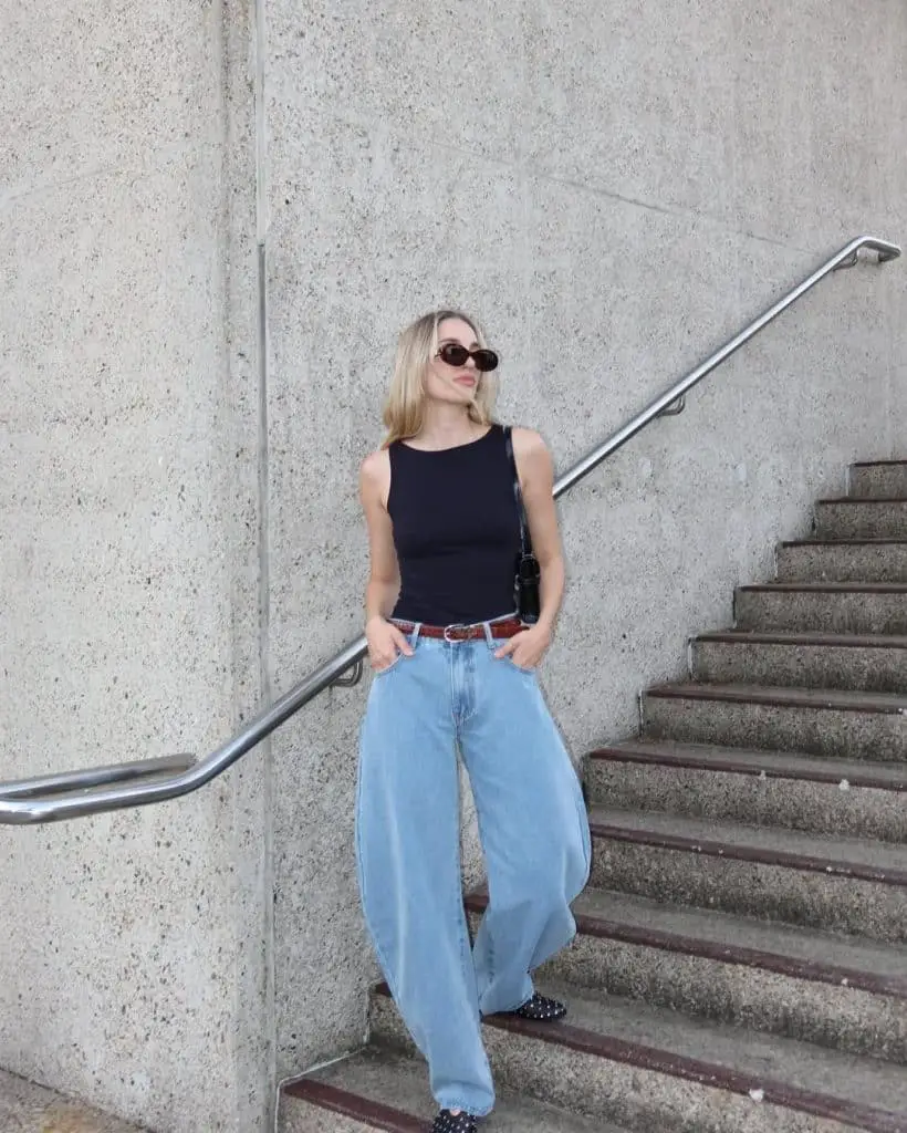 Black Sleeveless Top and Brown Belt with Light Blue Wide Leg Jeans Black Sleeveless Top and Brown Belt with Light Blue Wide Leg Jeans — Simple Wide Leg Jeans Outfits
