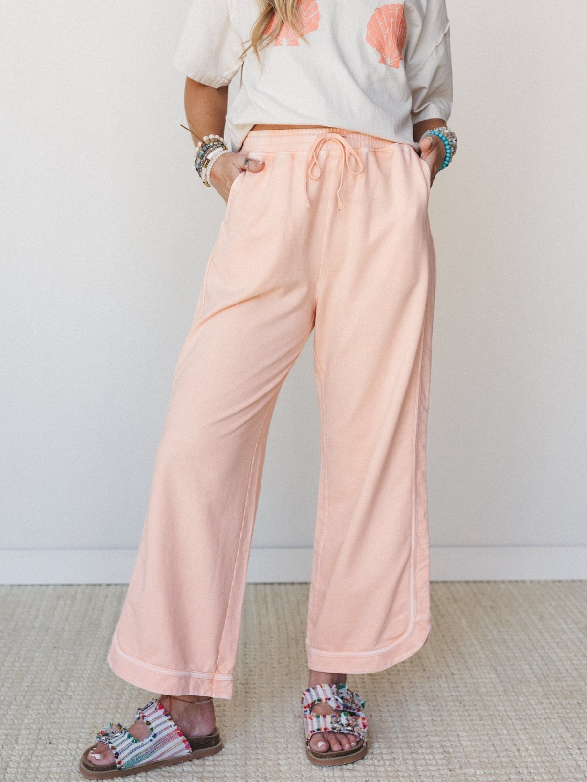 Peach Wide Leg Pants With Graphic T-Shirt Peach Wide Leg Pants With Graphic T-Shirt — Simple Wide Leg Pants Outfits