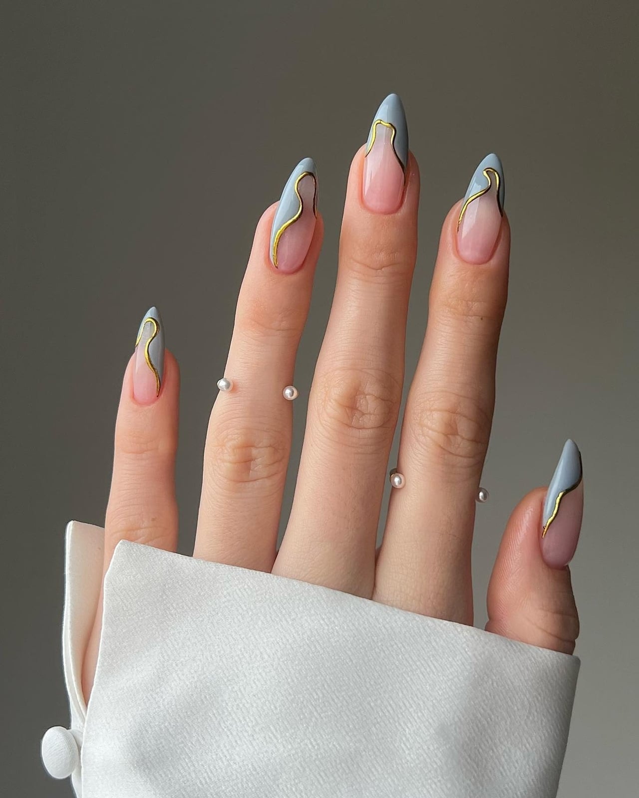 Sheer Pink Gold Wavy Line Stiletto Nails Sheer Pink Gold Wavy Line Stiletto Nails — Trendy Baby Blue Nails