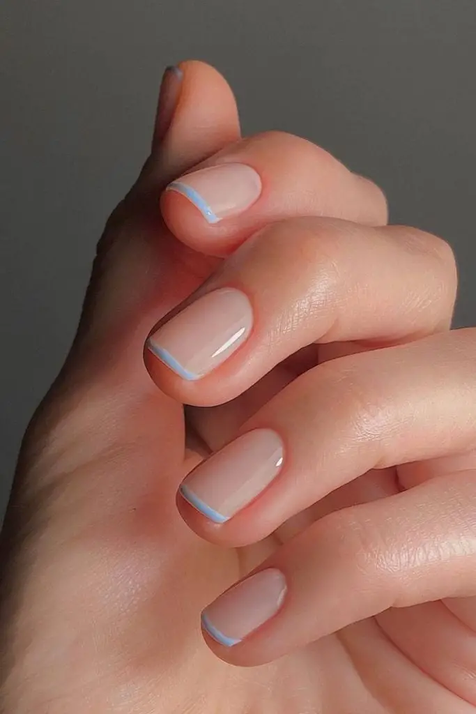 Short Almond Sheer Nude Thin Baby Blue French Tips, Glossy Short Almond Sheer Nude Thin Baby Blue French Tips, Glossy — Trendy Baby Blue Nails