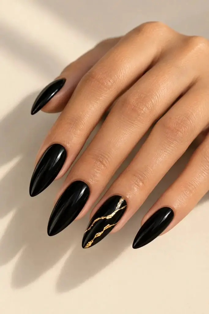 Medium Almond Black With Gold Lines Medium Almond Black With Gold Lines — Trendy Black Almond Nails