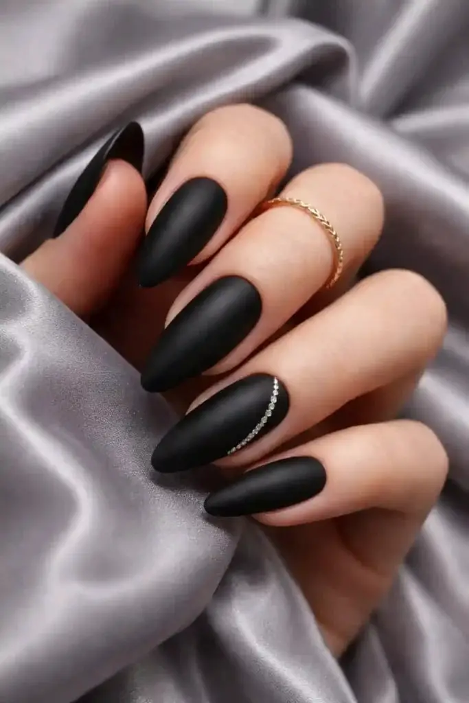 Matte Black Almond With Rhinestone Cuticle Matte Black Almond With Rhinestone Cuticle — Trendy Black Almond Nails