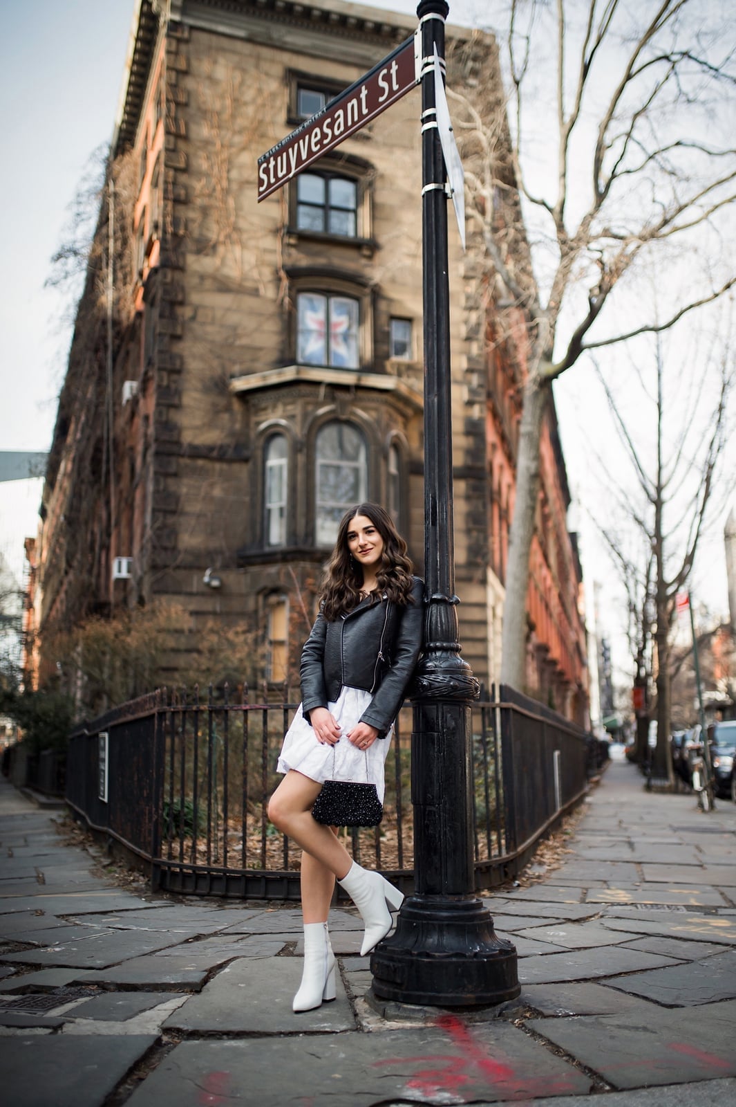 Leather Jacket Over White Mini Dress, Close-Up Take — Trendy Black and White Outfits