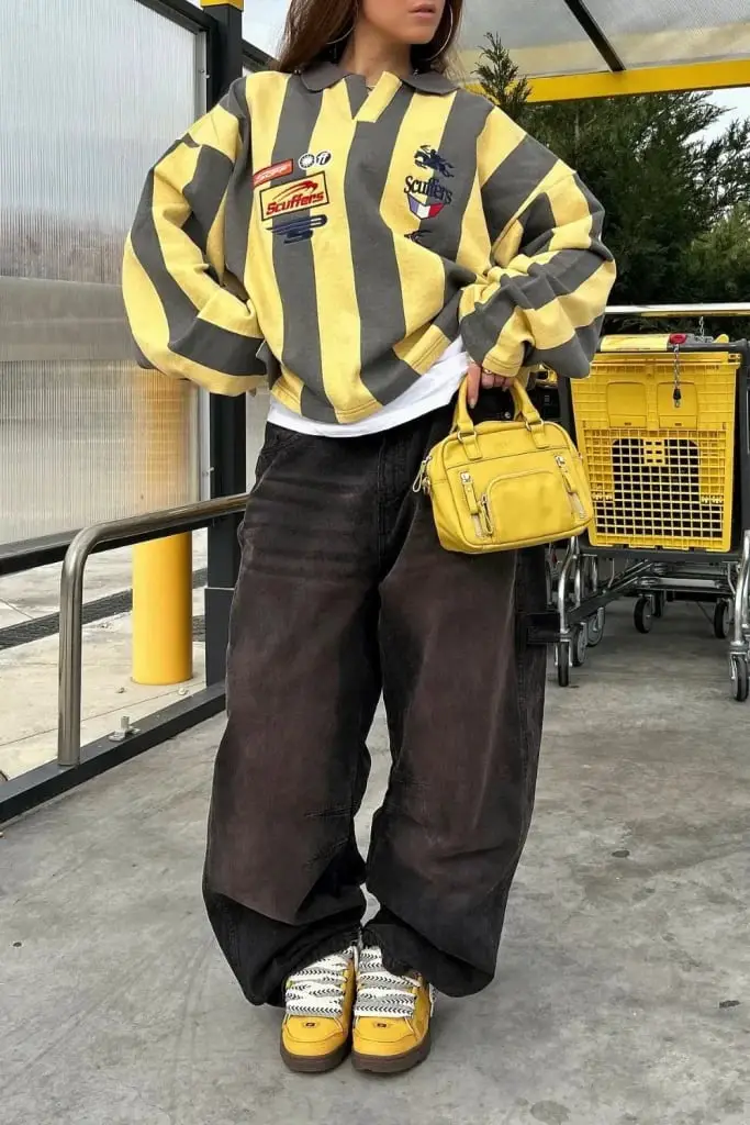 Black Baggy Jeans with a Striped Sweatshirt and Yellow Bag Black Baggy Jeans with a Striped Sweatshirt and Yellow Bag — Trendy Black Baggy Jeans Outfit