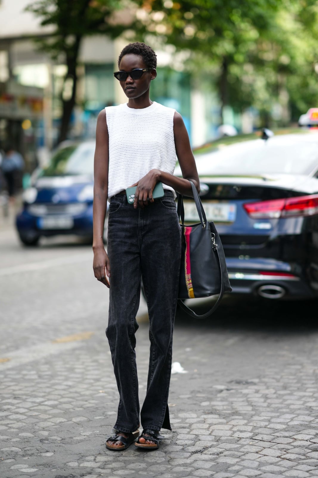 Black Baggy Jeans with a Sleeveless Knit Top Black Baggy Jeans with a Sleeveless Knit Top — Trendy Black Baggy Jeans Outfit