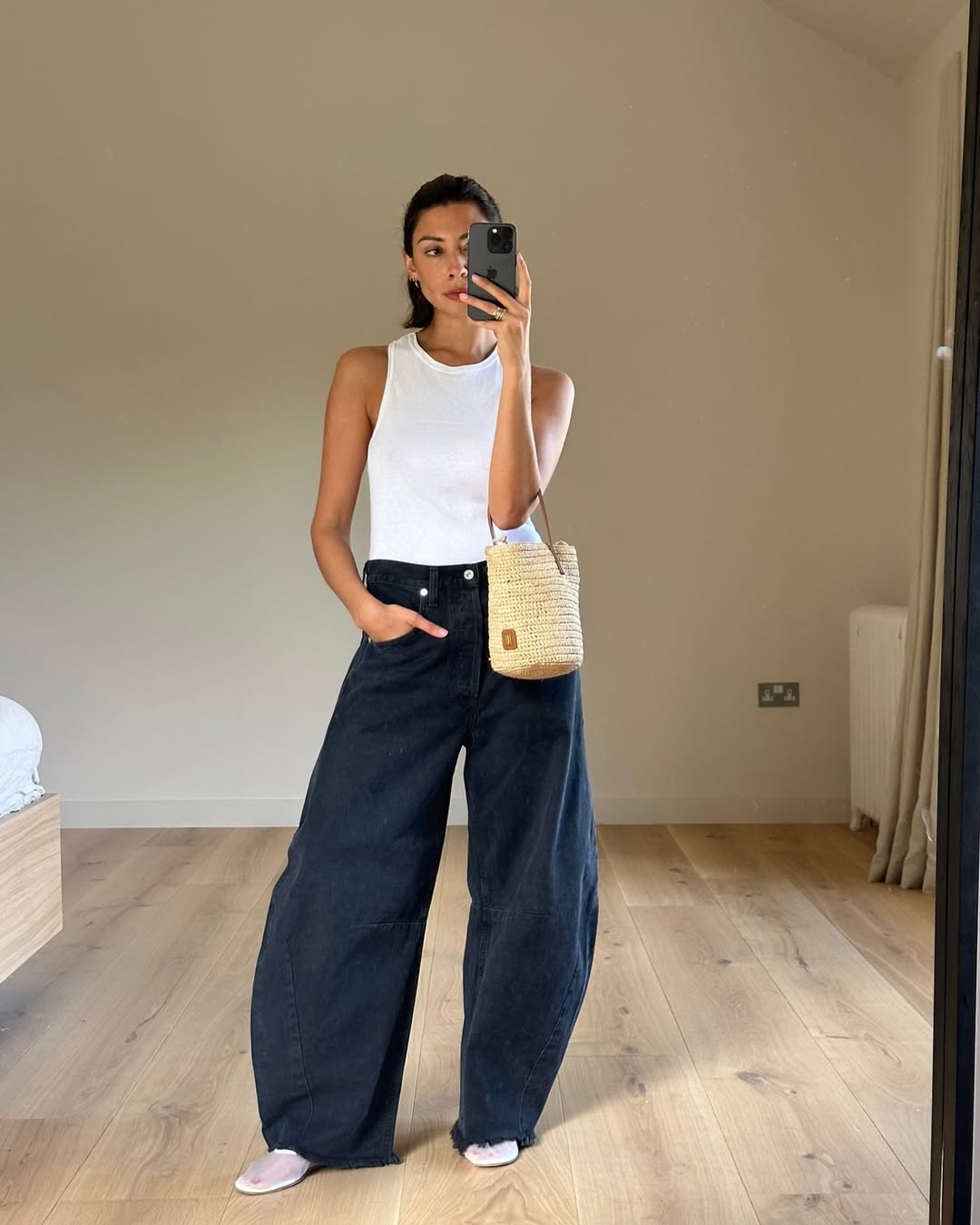 White Tank Top and Black Barrel Jeans with Slip-On Shoes White Tank Top and Black Barrel Jeans with Slip-On Shoes — Trendy Black Barrel Jeans Outfit
