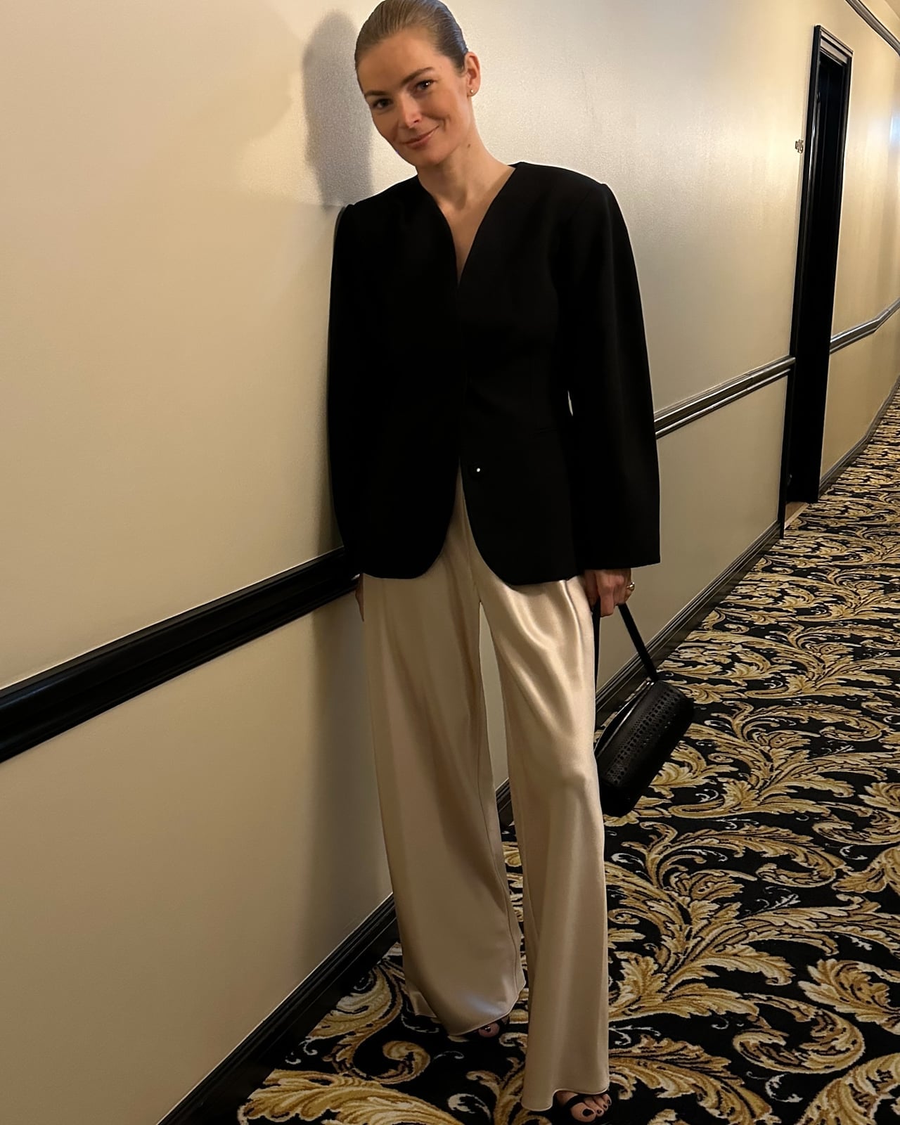 Black Blazer With Wide Leg Satin Trousers, Close-Up Take — Trendy Black Blazer Outfit