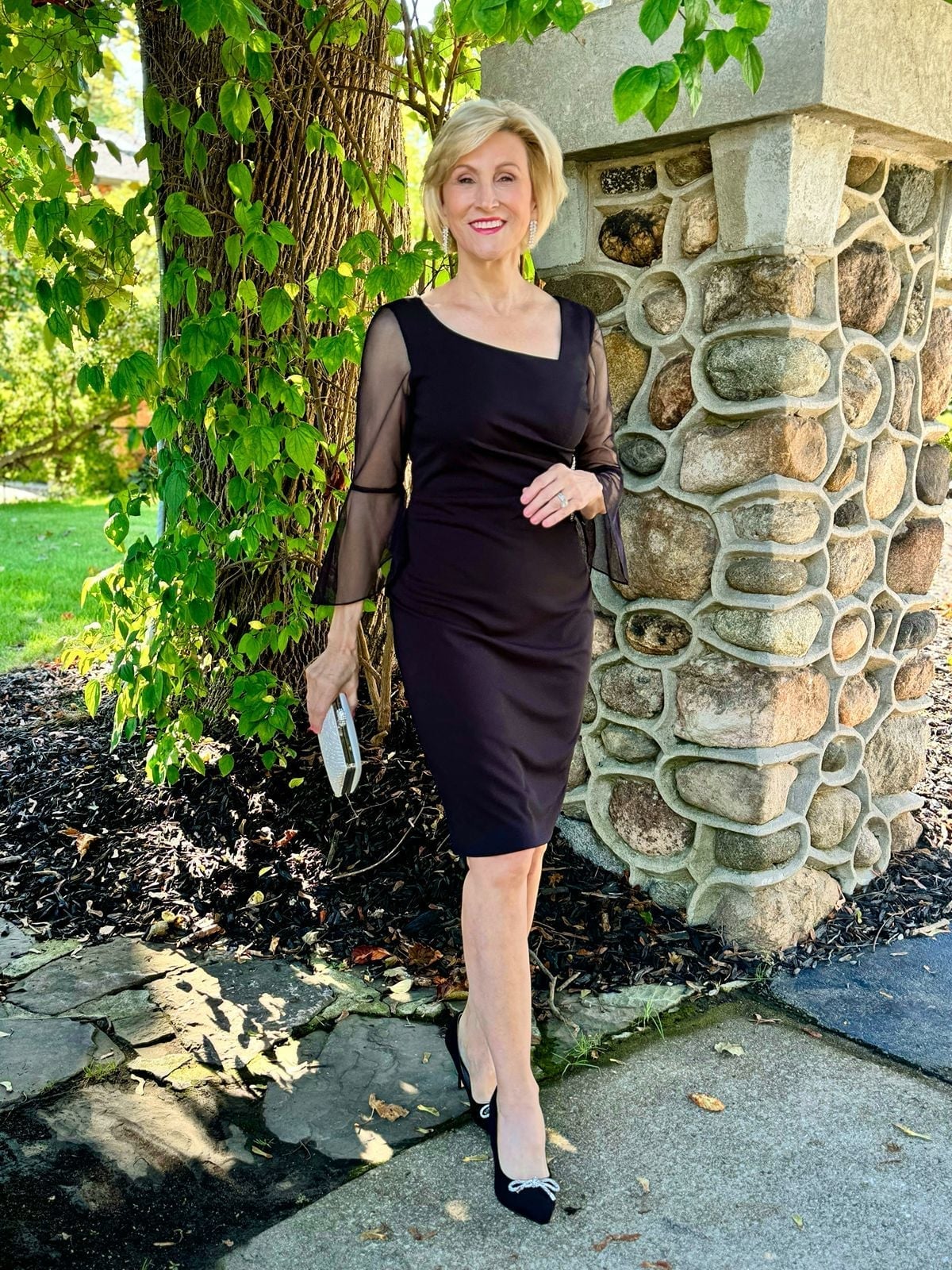 Black Dress with Sheer Bell Sleeves and Bow Flats — Trendy Black Dress Outfits