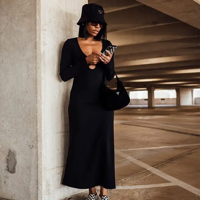 Fitted Black Maxi Dress with Keyhole Detail and Sneakers — Trendy Black Dress Outfits