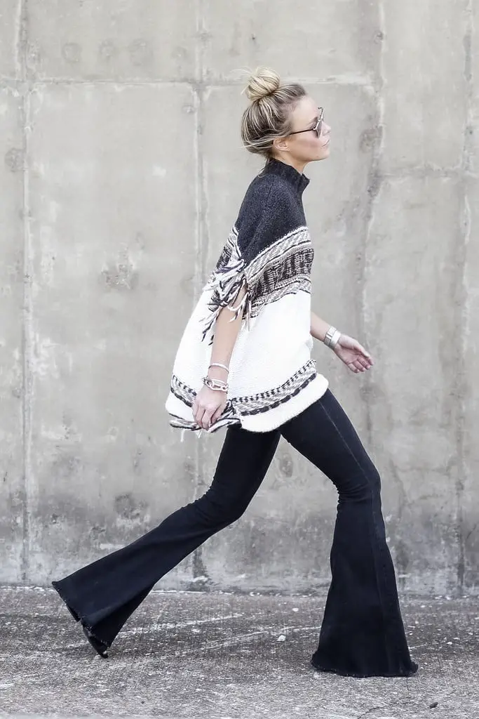 Black Flare Jeans with Patterned Poncho and Heels — Trendy Black Flare Jeans Outfit