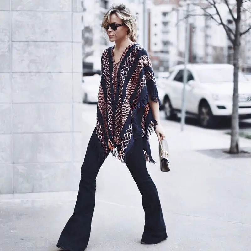 Black Wide Leg Jeans with Fringed Poncho — Trendy Black Flare Jeans Outfit