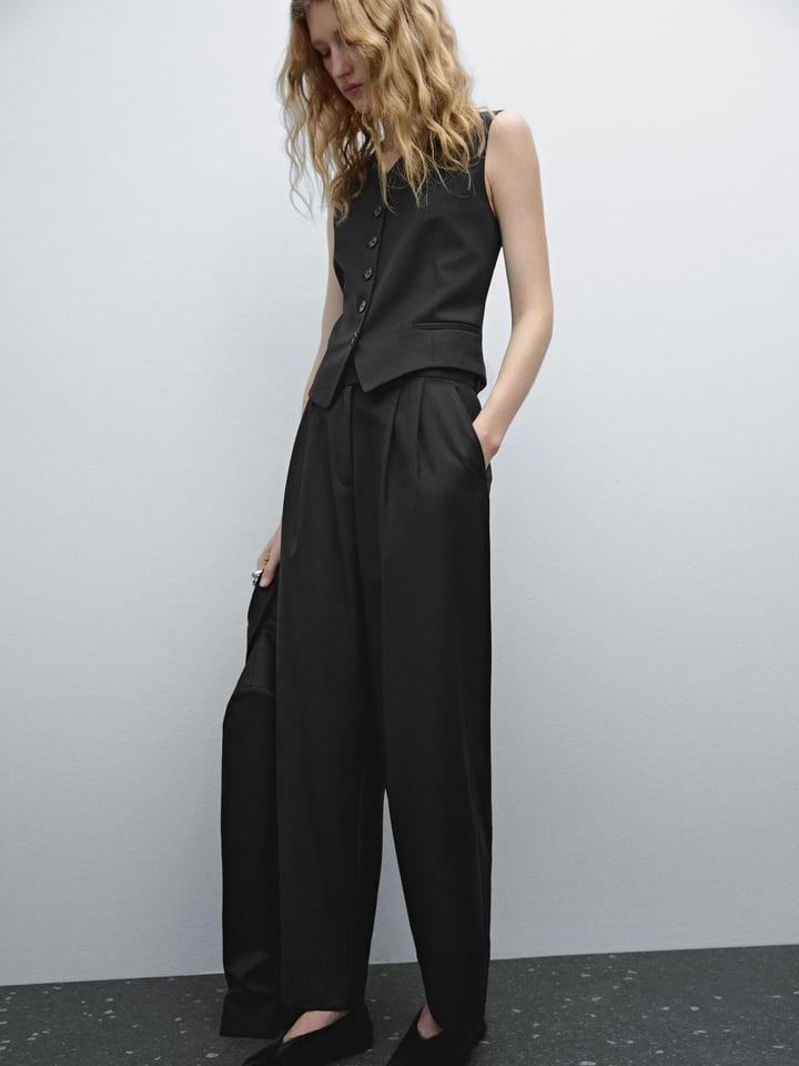 Pleated Black Trousers with Sleeveless Vest — Trendy Black Trousers Outfit