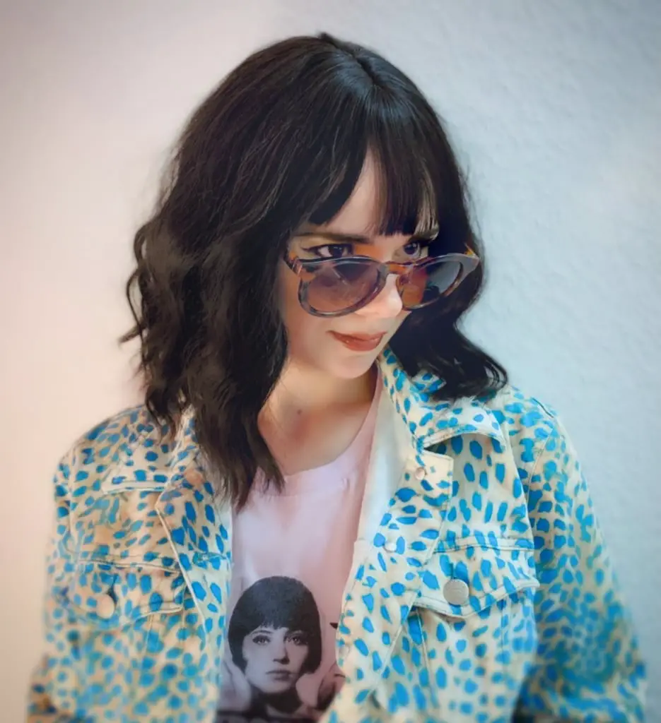 Chin Length Wavy Bob With Curtain Bangs and Styled In A Soft Blowout Chin Length Wavy Bob With Curtain Bangs and Styled In A Soft Blowout — Trendy Black Wig