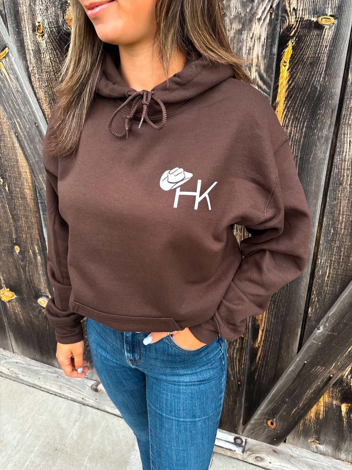 Brown Cropped Hoodie with Graphic Logo and Blue Jeans Brown Cropped Hoodie with Graphic Logo and Blue Jeans — Trendy Brown Hoodie Outfit