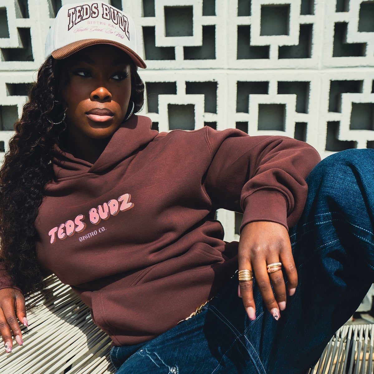 Oversized Brown Hoodie with Pink Graphic Text and Trucker Hat Oversized Brown Hoodie with Pink Graphic Text and Trucker Hat — Trendy Brown Hoodie Outfit