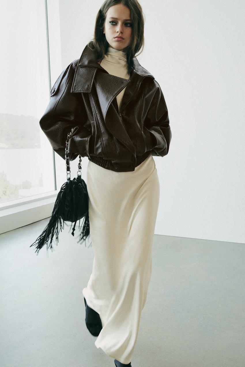 Dark Brown Biker Jacket Over a Cream Turtleneck and Slip Dress — Trendy Brown Jacket Outfit