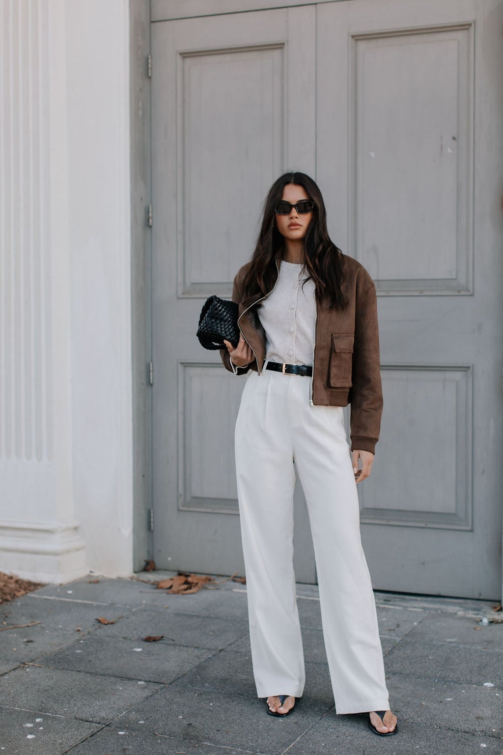 Oversized Brown Bomber Jacket with Gray Sweater and White Pants — Trendy Brown Jacket Outfit
