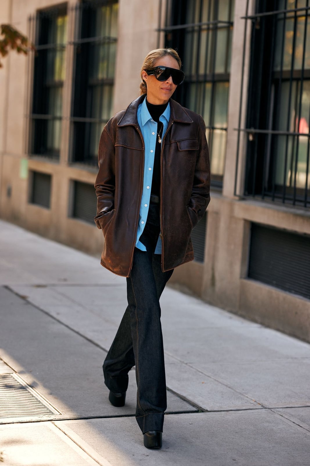 Oversized Brown Leather Jacket with Wide-Leg Jeans, Close-Up Take — Trendy Brown Outfits