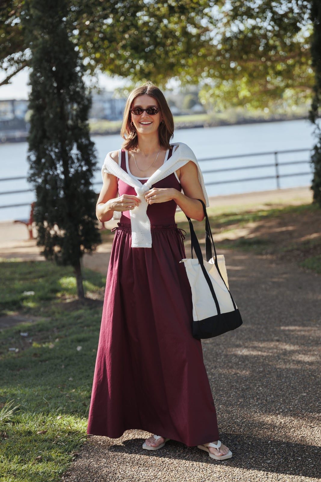 Burgundy Maxi Dress Styled Casually with Draped Sweater — Trendy Burgundy Dress Outfit