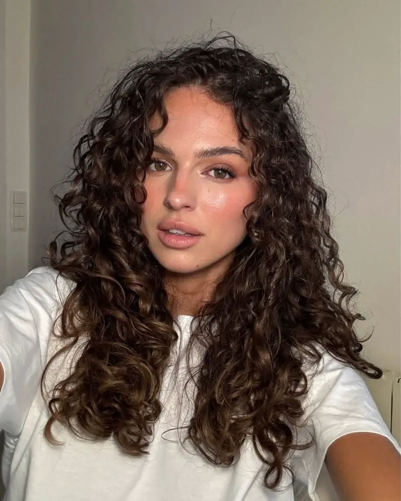 Collarbone Thick Curls With Curtain Bangs Collarbone Thick Curls With Curtain Bangs — Trendy Curly Hair