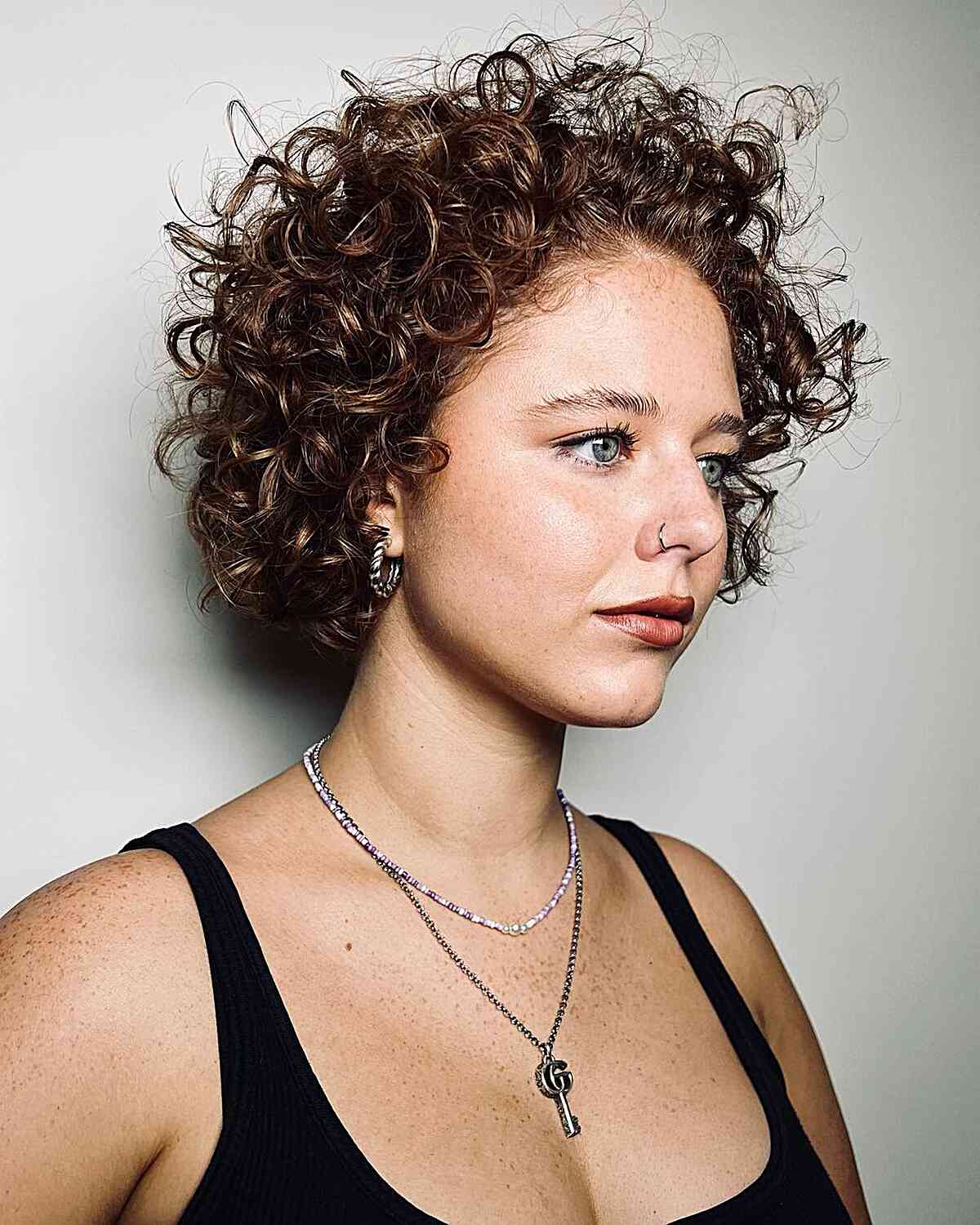 Short Reddish Brown Curly Pixie With Short Bangs Short Reddish Brown Curly Pixie With Short Bangs — Trendy Curly Hair