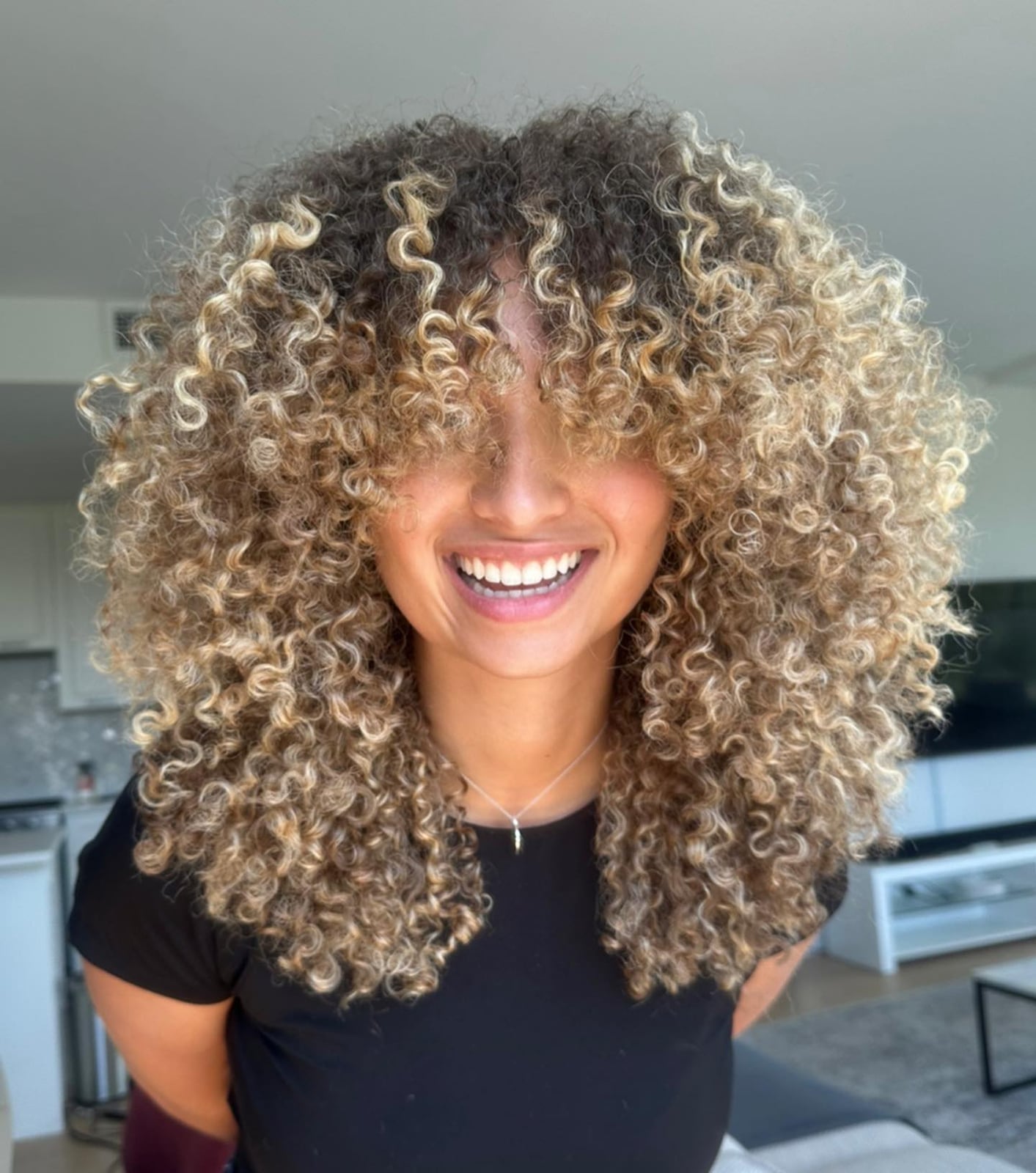 Collarbone Dark Brown With Caramel Blonde Balayage and Air Dried — Trendy Curly Hair Color