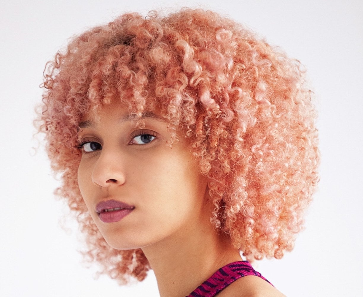 Ear Length Pastel Pink Bob — Trendy Curly Hair Color