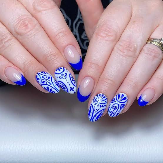 Medium Almond Blue Patterns and French Tips Medium Almond Blue Patterns and French Tips — Trendy Dark Blue Nails