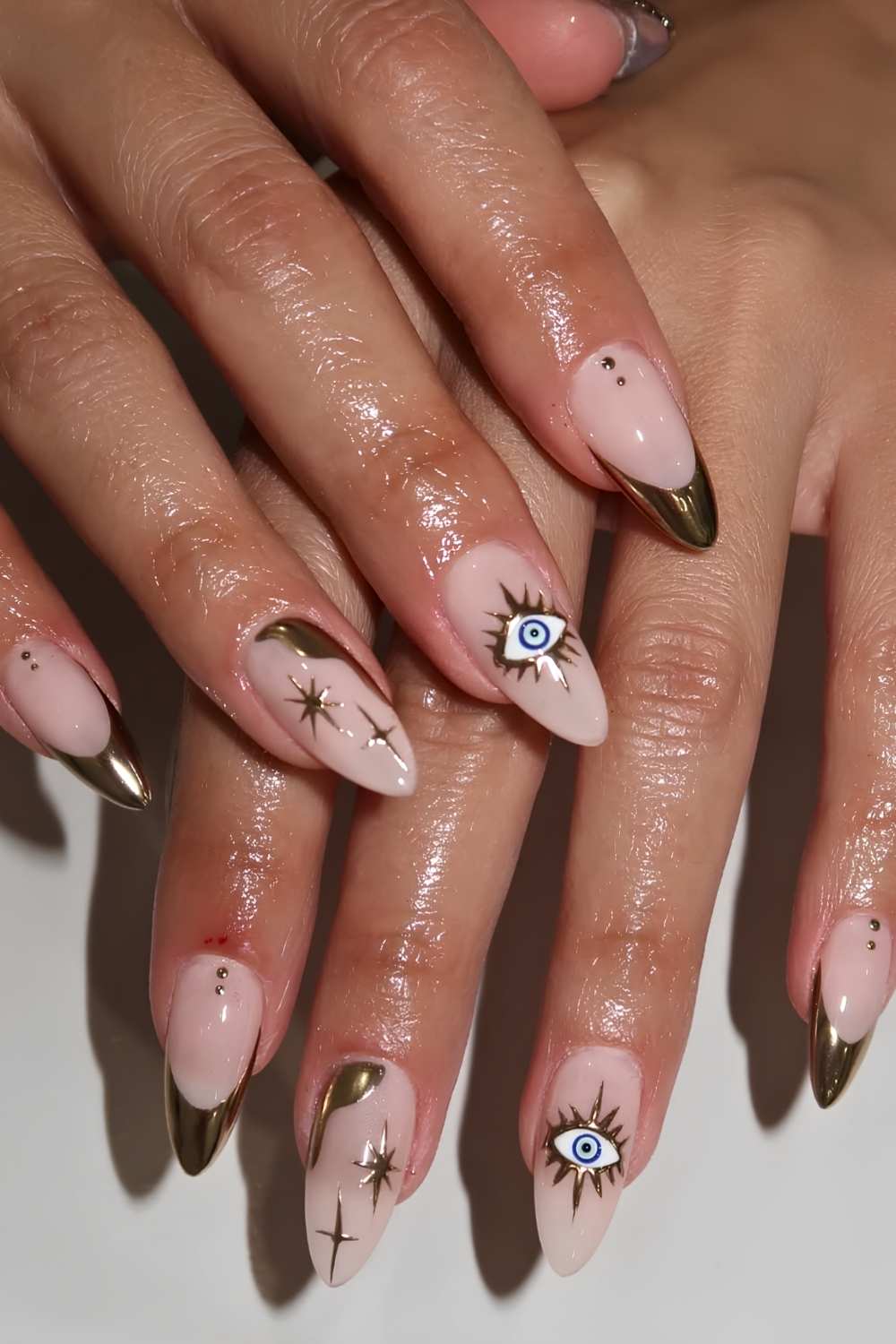 Medium Almond Nude Pink With Gold French Tip And Evil Eye — Trendy Evil Eye Nails