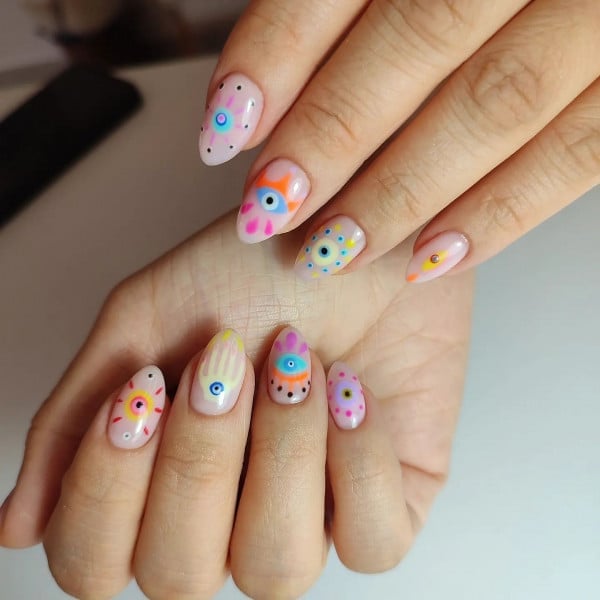 Short Almond Nude Base Multicolor Evil Eye Designs — Trendy Evil Eye Nails