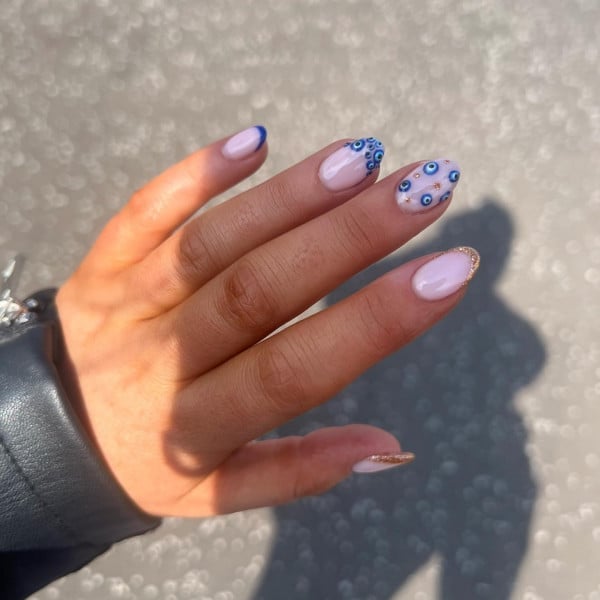 Short Oval Pale Pink With Blue Gold Evil Eye Shimmer — Trendy Evil Eye Nails