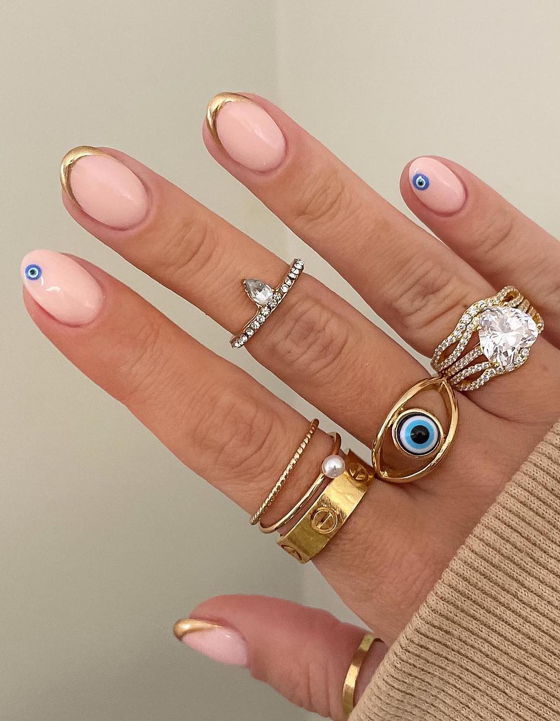 Medium Almond White Nails With Blue Eyes And Gold Stars — Trendy Evil Eye Nails