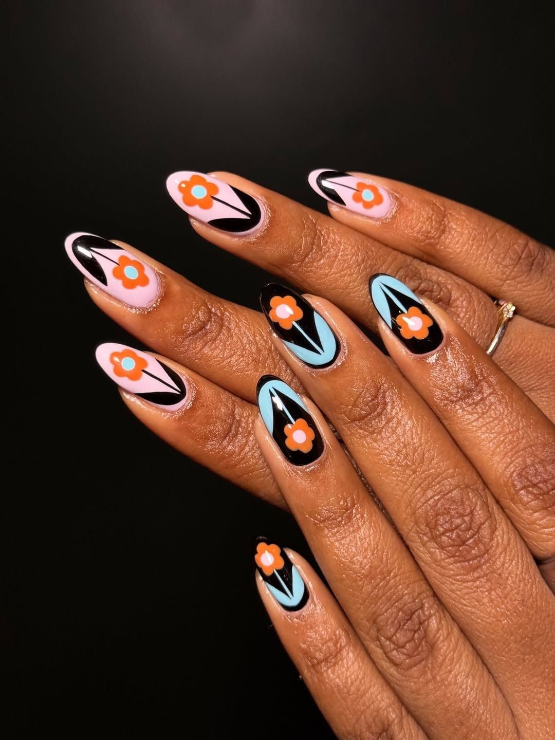 Medium Almond Nails With Graphic Floral Motifs Medium Almond Nails With Graphic Floral Motifs — Trendy Flower Nails
