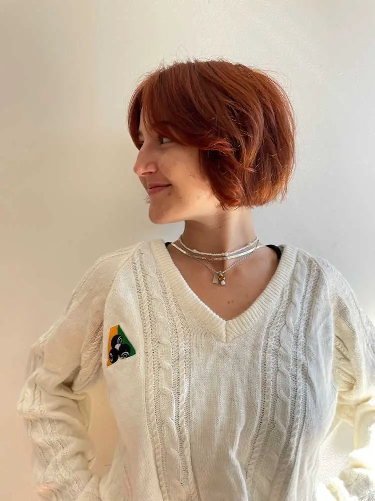Chin Length Copper Bob With Curtain Bangs and Showing A Fine — Trendy Ginger Hair