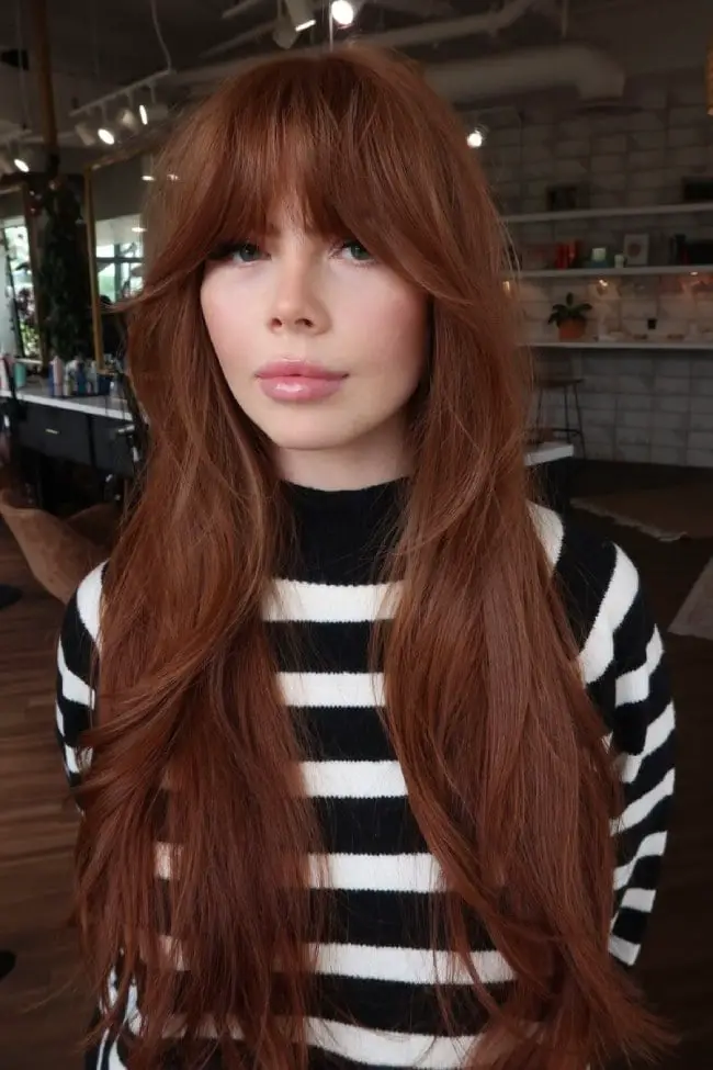 Long Wavy Copper Auburn With Curtain Bangs — Trendy Ginger Hair