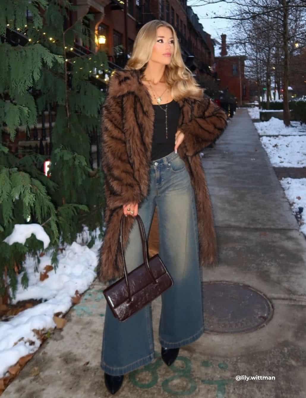 Faux Fur Coat Over Black Top And Wide Leg Jeans — Trendy Going Out Outfits