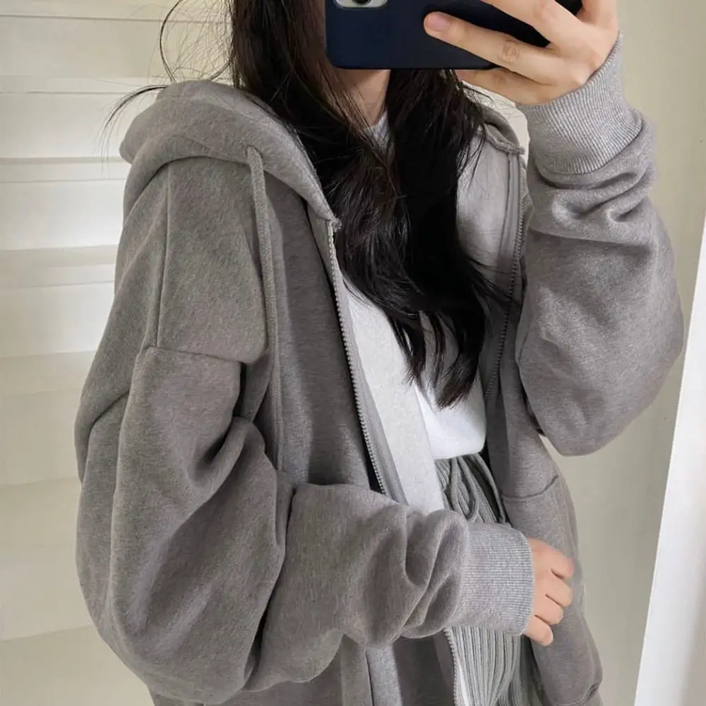 Gray Oversized Zip-Up Hoodie Over White T-Shirt, Close-Up Take — Trendy Grey Hoodie Outfit