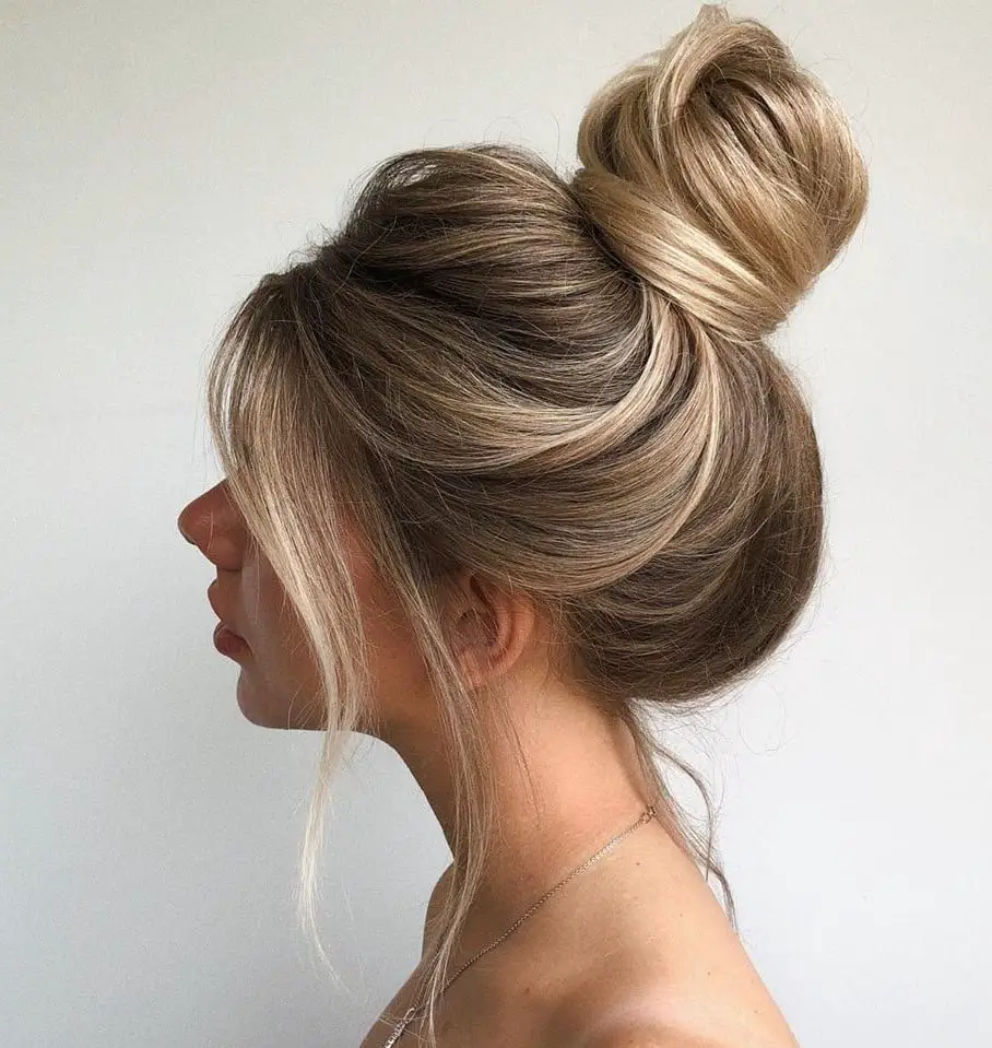 Blonde Balayage High Bun with Curtain Bangs Blonde Balayage High Bun with Curtain Bangs — Trendy Hair Up Hairstyles