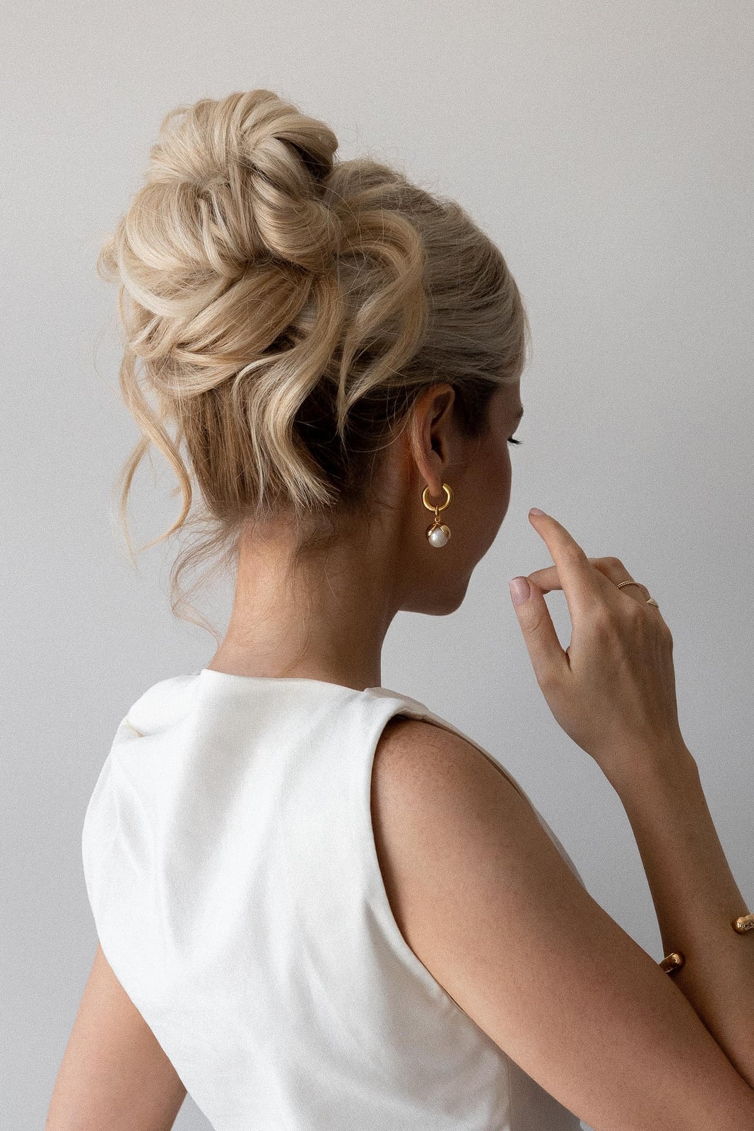 Platinum Blonde High Updo with Wispy Bangs Platinum Blonde High Updo with Wispy Bangs — Trendy Hair Up Hairstyles