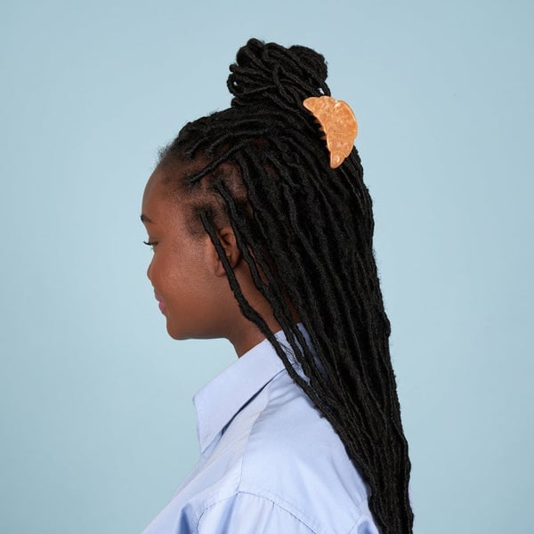 High Top Knot With Braids And Crescent Clip High Top Knot With Braids And Crescent Clip — Trendy Hair with Clips